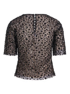 Haust Pearl Party Blouse i sort med paljetter og knapper i nakken, sett bakfra